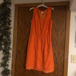 orange and white polka dot sleeveless mini dress